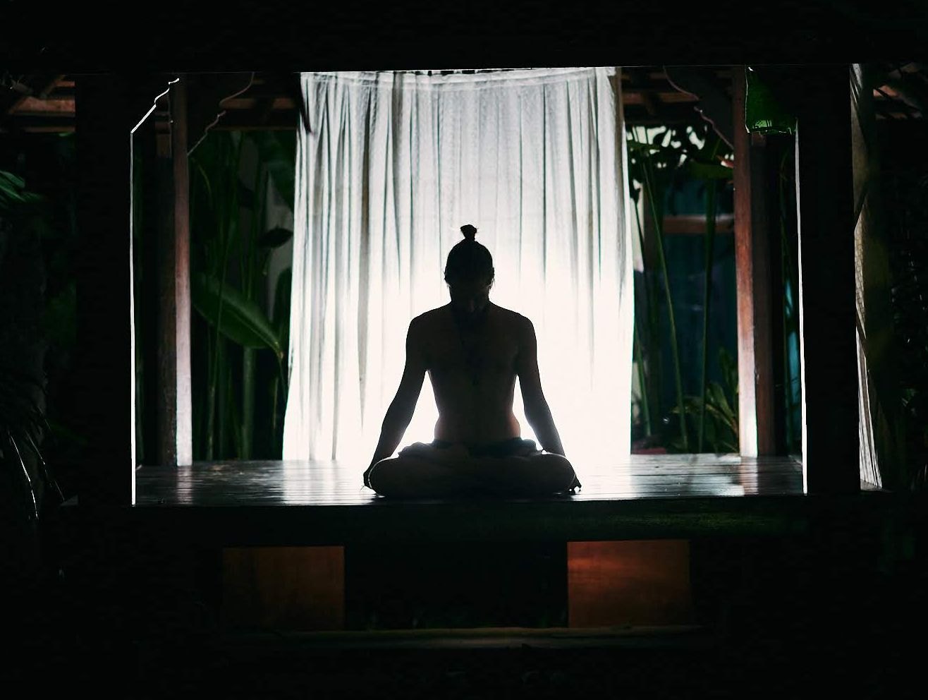 Silhouette of a person in a yoga pose
